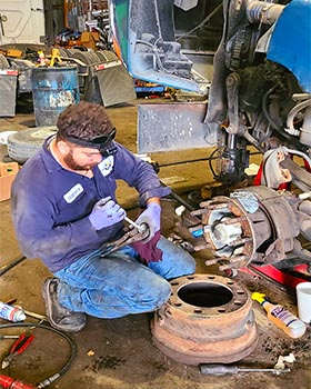Semi-truck brake shoes and drum inspection at Salazar Semi-Truck Repair in Dallas, TX