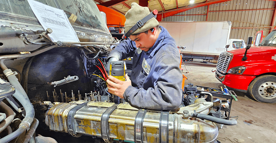 Salazar Semi-Truck Repair shop in Dallas TX servicing Cummins injector cup failure with diesel in coolant